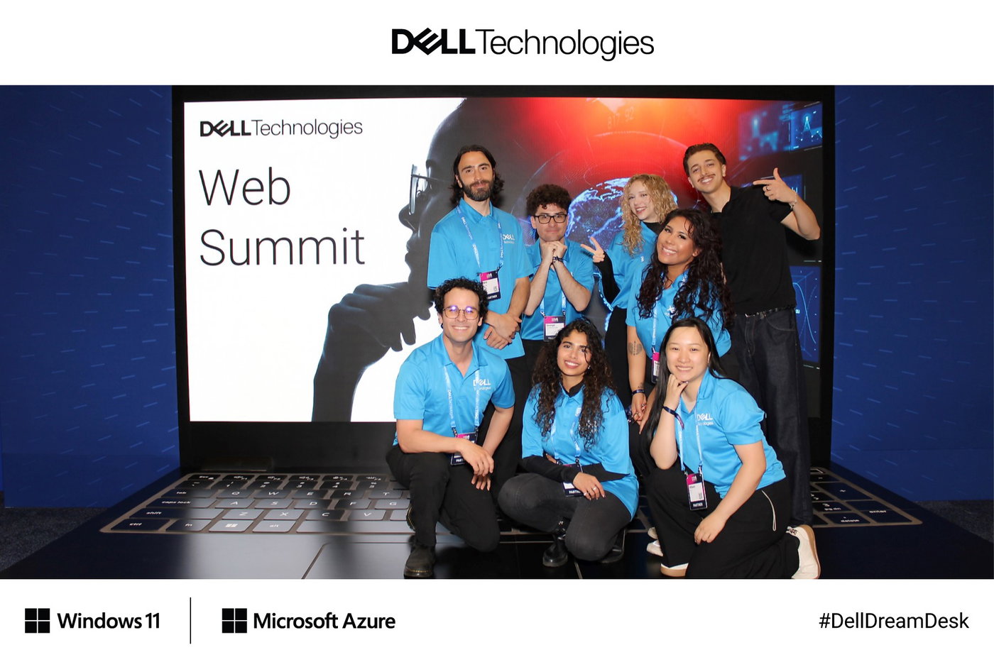The Dell Technologies team posing on a giant laptop stage with a Web Summit screen, framed with Dell, Windows 11 and Microsoft Azure branding