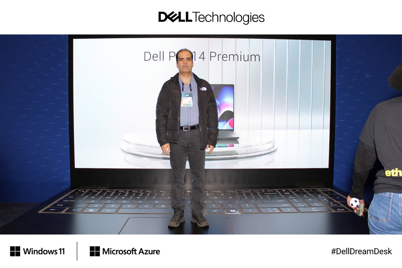 A guest on the giant laptop with a Dell Pro product launch on its screen