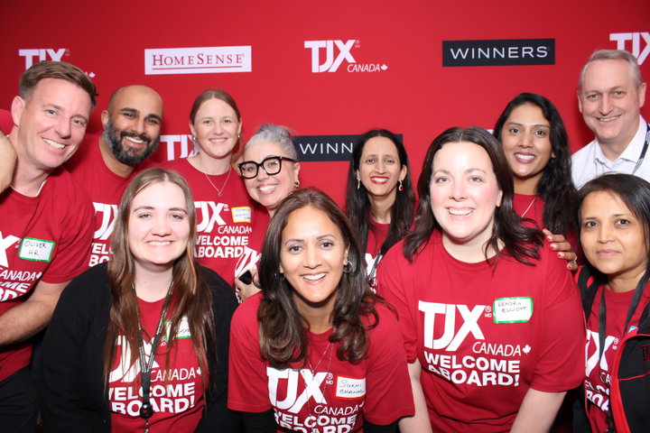 A team in Welcome Aboard tees at a corporate photo booth
